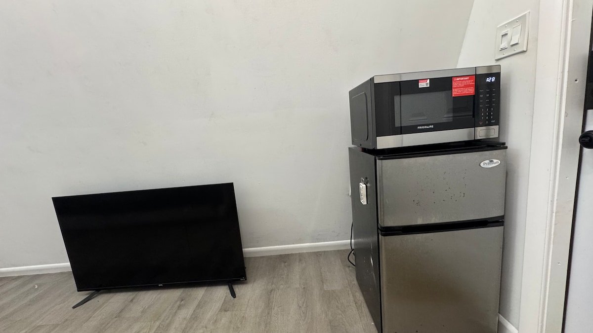 Mini fridge, microwave and TV