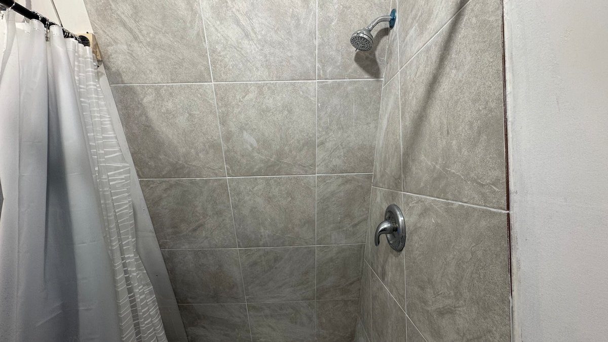 Tiled shower with curtain