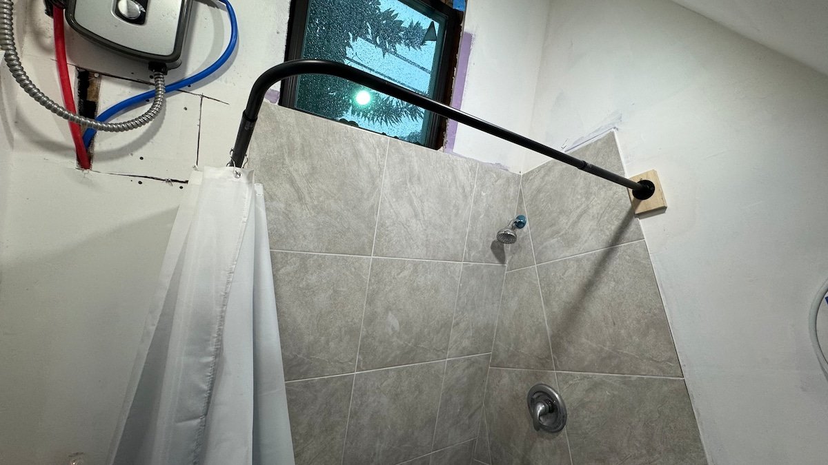 Shower with tankless water heater