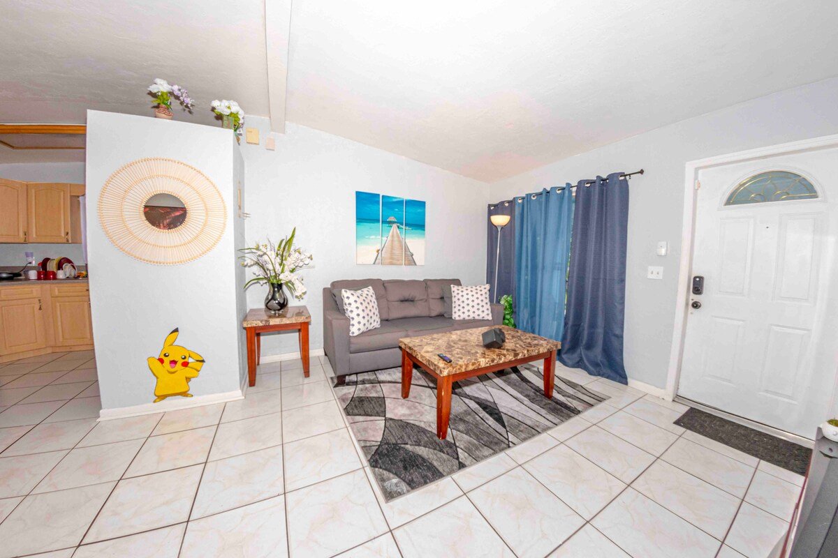 Living room with painted Pikachu wall mural
