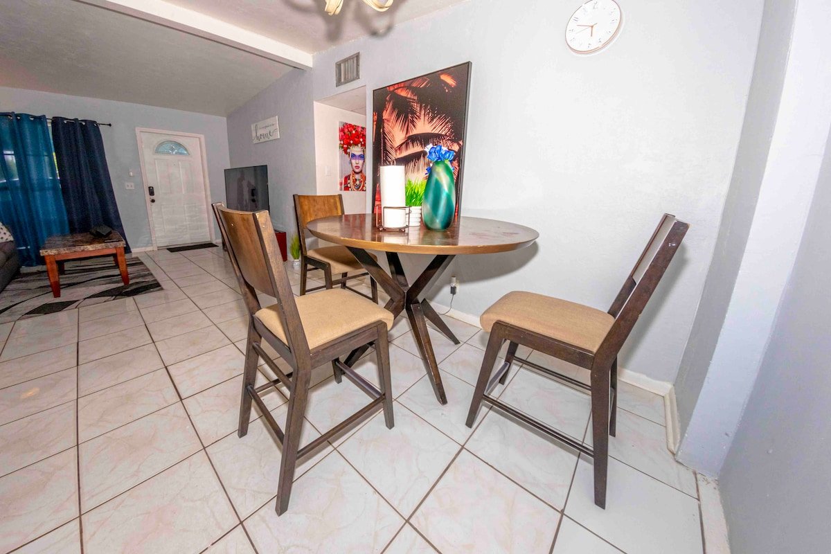 Dining table and chairs with view to the living room