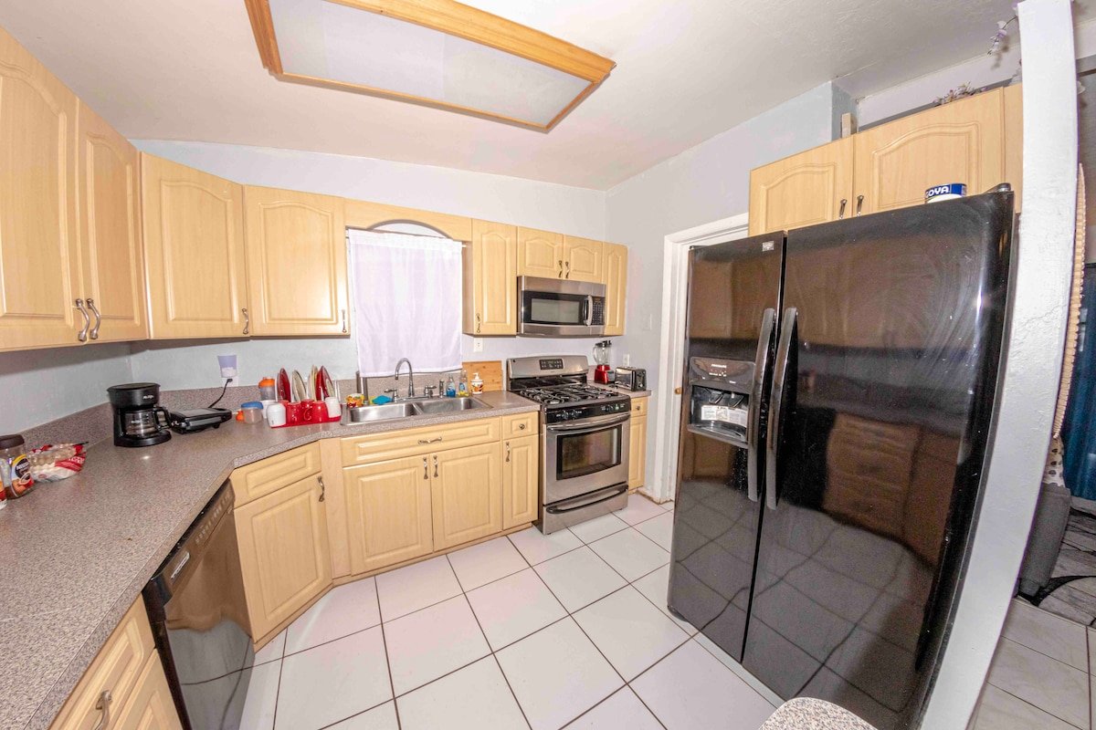 Kitchen with refrigerator and range